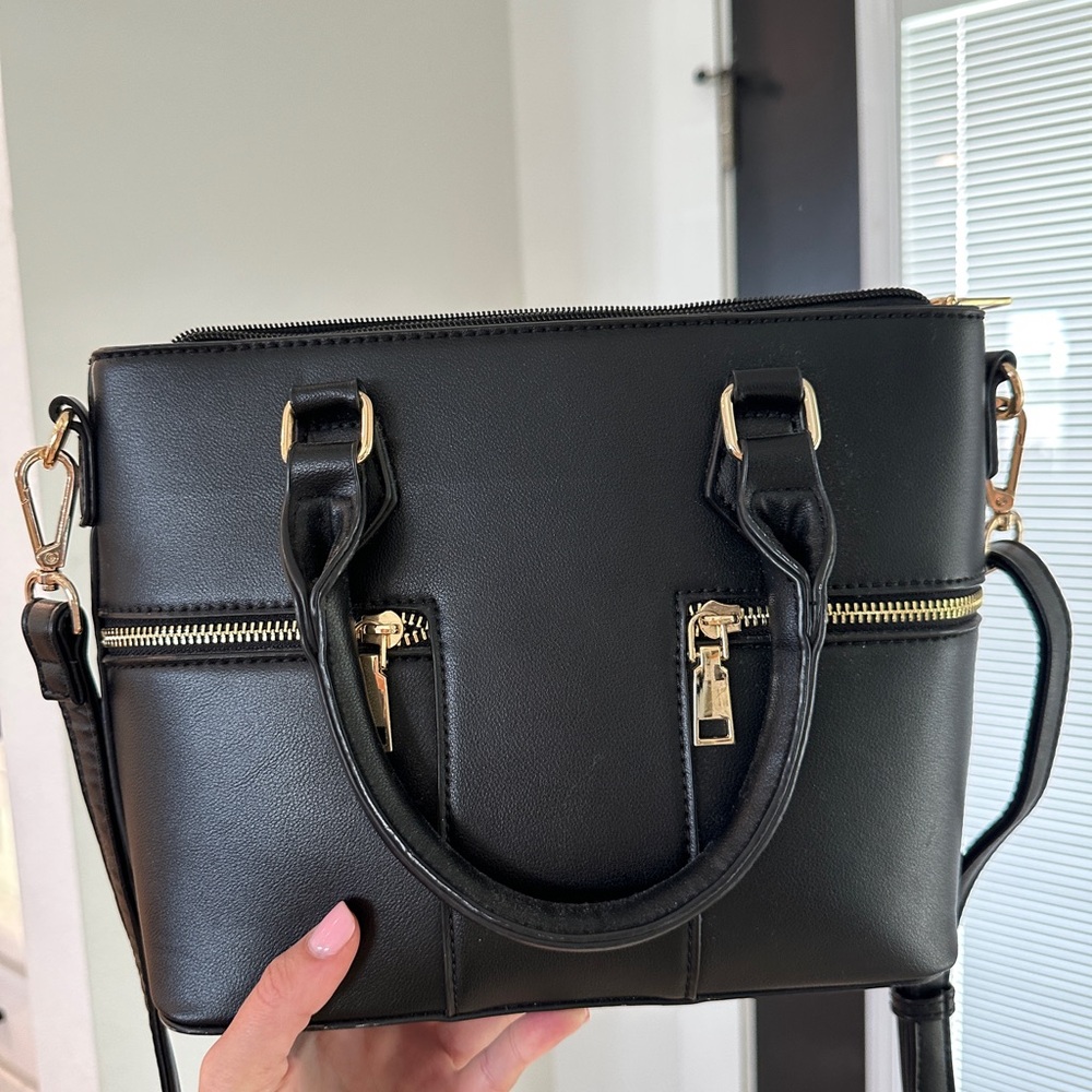 Black handbag with gold hardware